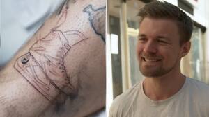 Se dansk superfan få ishockey-tatovering